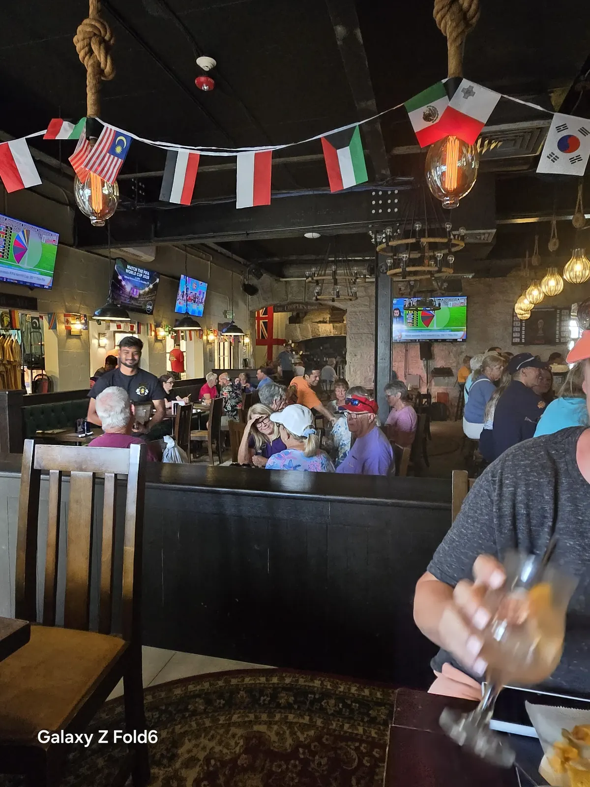 the cruise hq busy pub dining room full of cruise passengers at royal naval dockyard bermuda
