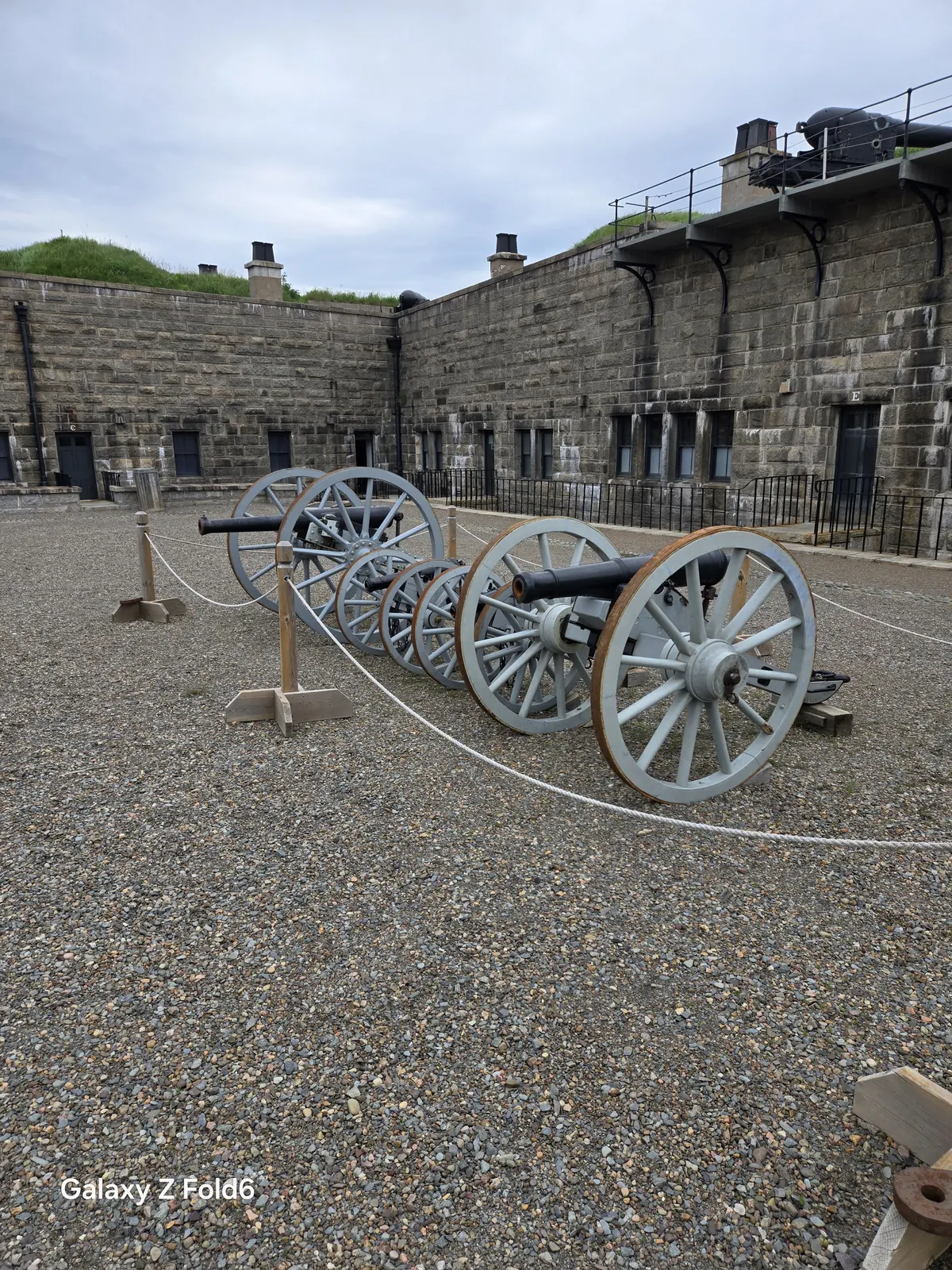 the cruise hq antique cannons on wheeled carriages in front of the stone fortress walls at halifax citadel