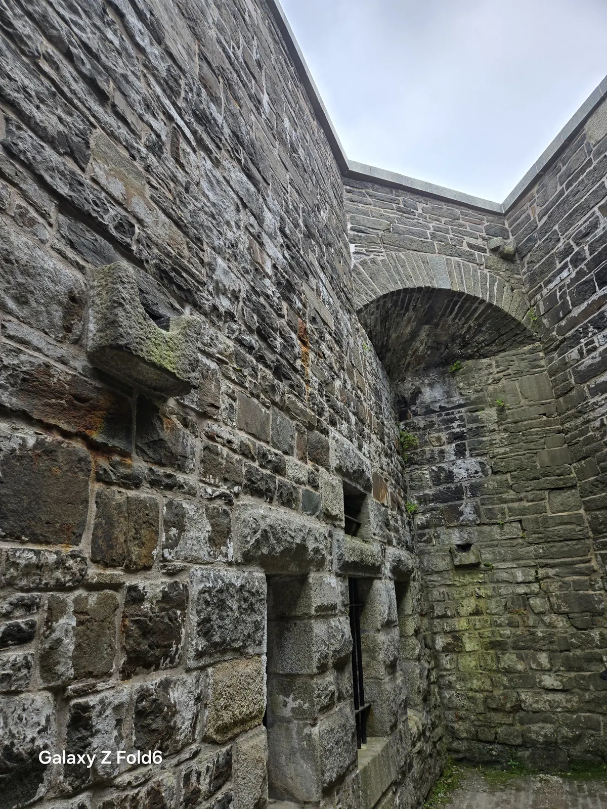 the cruise hq weathered stone wall and archway inside the fortress at halifax citadel