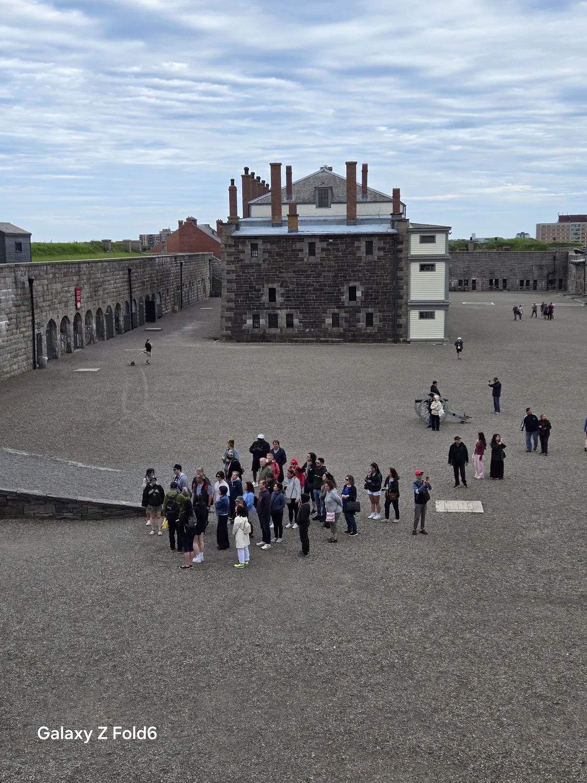 the cruise hq visitors gather on the gravel parade square below the cavalier building at halifax citadel