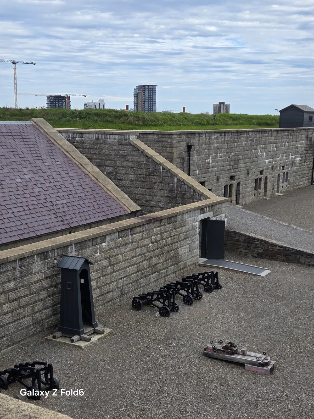 the cruise hq rooftop view of the fort with a sentry box and cannons below at halifax citadel