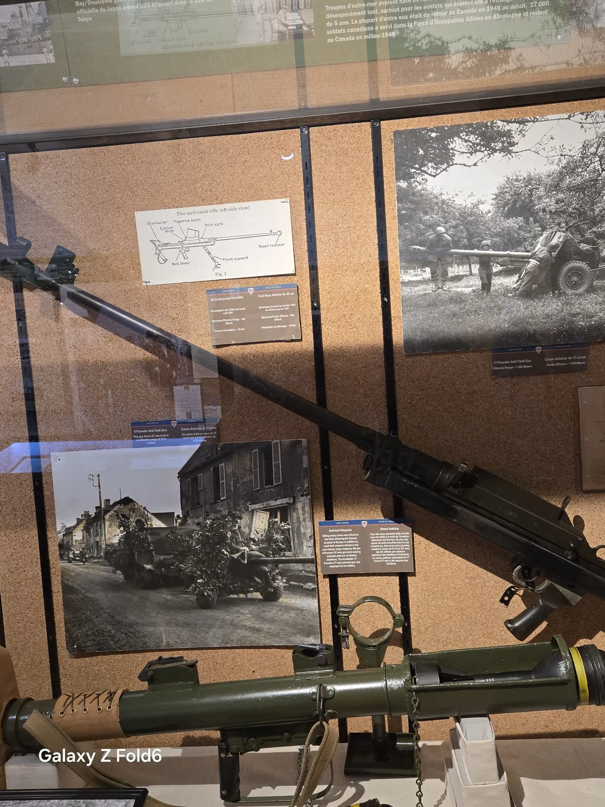 the cruise hq display case with a wartime photo and an anti tank weapon at halifax citadel