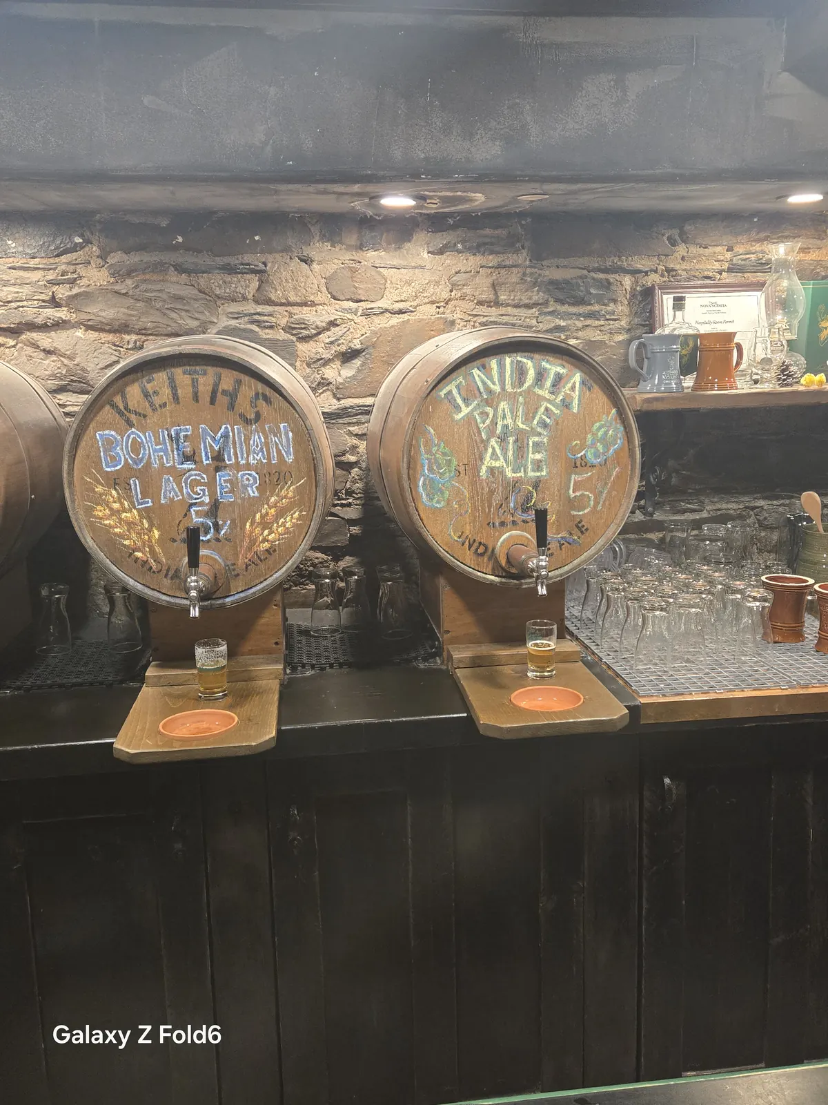 the cruise hq painted barrels of keith's Bohemian Lager and India Pale Ale with sample glasses at Alexander Keith's Brewery in Halifax